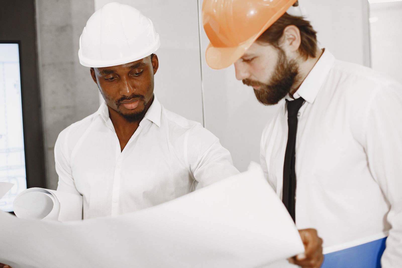 Two professionals reviewing plans together